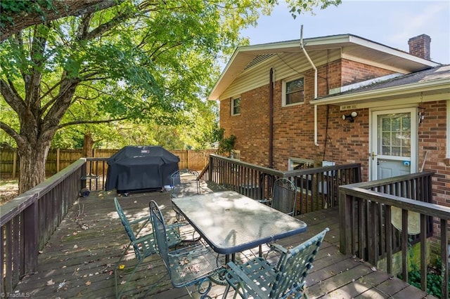 wooden deck featuring grilling area