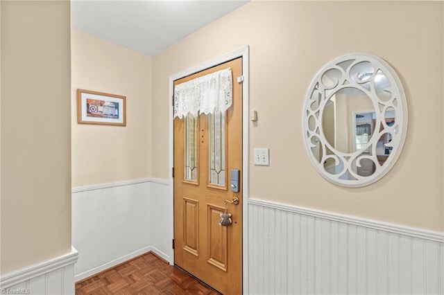 doorway featuring parquet flooring