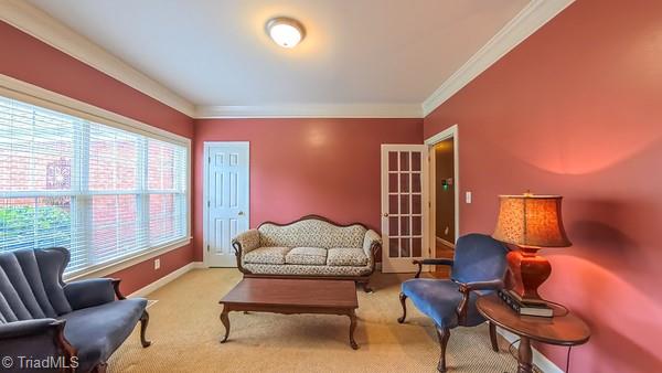 5110 Hartridge Way, Greensboro, NC 27407 - sitting room featuring ornamental molding, baseboards, carpet floors, and french doors