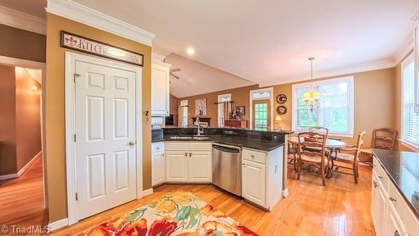 5110 Hartridge Way, Greensboro, NC 27407 - kitchen with dishwasher, a peninsula, crown molding, dark countertops, and a sink