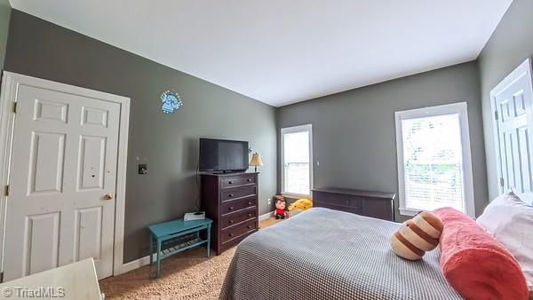 5110 Hartridge Way, Greensboro, NC 27407 - carpeted bedroom featuring baseboards