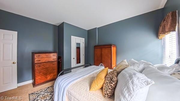 5110 Hartridge Way, Greensboro, NC 27407 - carpeted bedroom featuring lofted ceiling and baseboards