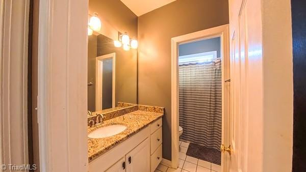 5110 Hartridge Way, Greensboro, NC 27407 - bathroom featuring vanity, toilet, and tile patterned floors