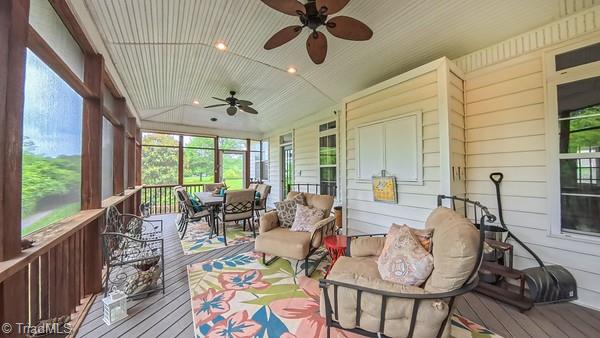 5110 Hartridge Way, Greensboro, NC 27407 - sunroom / solarium with ceiling fan, outdoor dining area, and plenty of natural light