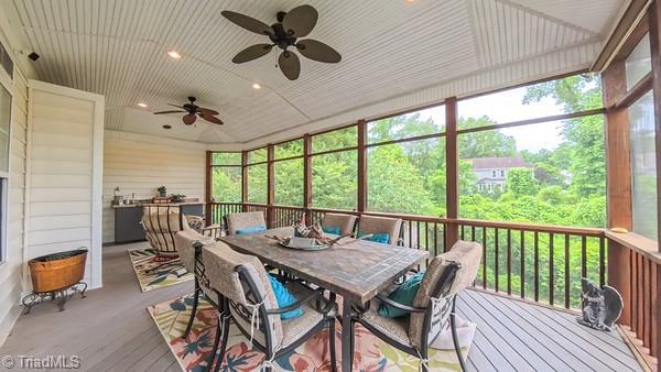 5110 Hartridge Way, Greensboro, NC 27407 - sunroom / solarium with outdoor dining area and ceiling fan