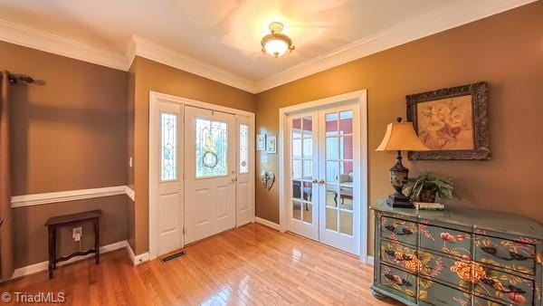 5110 Hartridge Way, Greensboro, NC 27407 - entryway featuring french doors, wood finished floors, crown molding, and baseboards