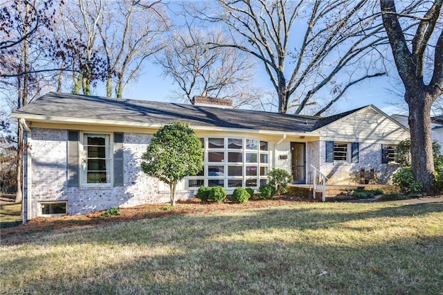 ranch-style house with a front lawn