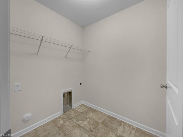 laundry room with laundry area, hookup for an electric dryer, and baseboards