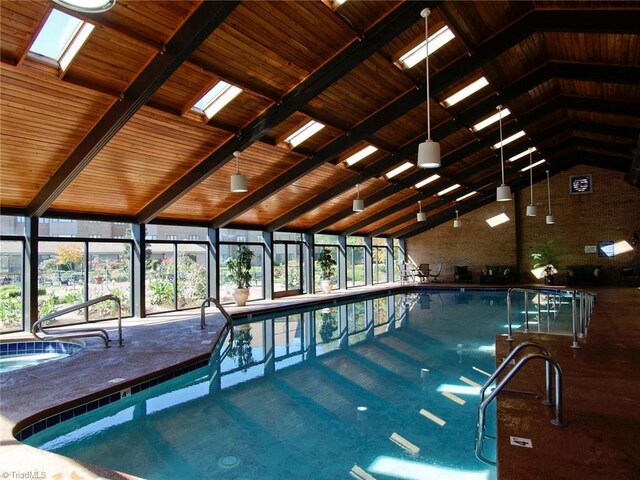 view of swimming pool featuring a skylight