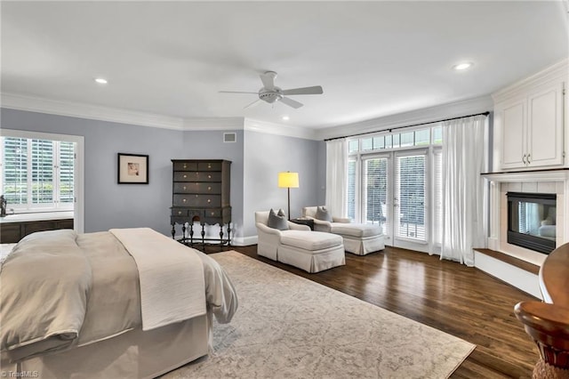 bedroom featuring dark wood-type flooring, recessed lighting, visible vents, and multiple windows