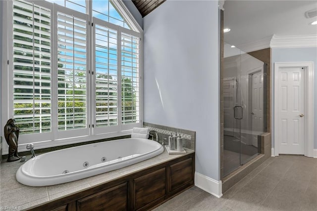 bathroom with a shower stall, a tub with jets, ornamental molding, and a healthy amount of sunlight