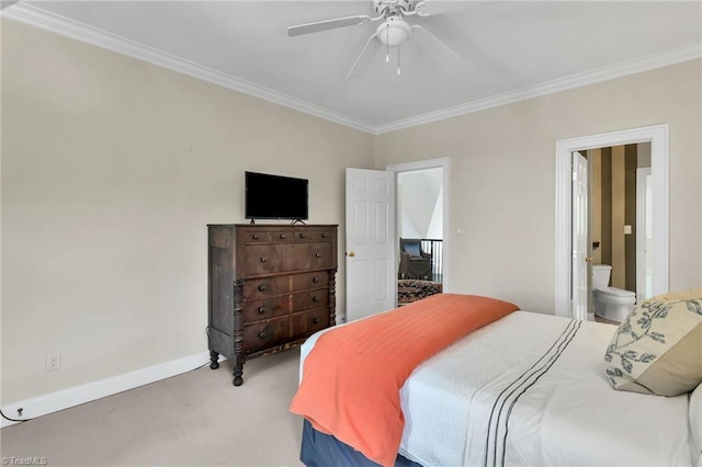 bedroom with a ceiling fan, ornamental molding, baseboards, ensuite bathroom, and carpet flooring