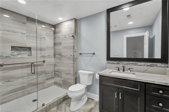 bathroom featuring recessed lighting, baseboards, vanity, and toilet