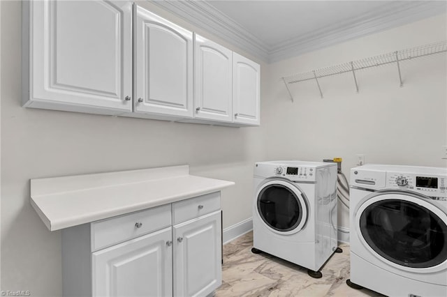 laundry room featuring washer and clothes dryer, marble finish floor, cabinet space, and ornamental molding