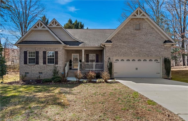 craftsman-style house with crawl space, a porch, concrete driveway, and brick siding