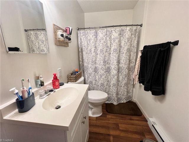 full bath featuring curtained shower, toilet, wood finished floors, vanity, and baseboard heating