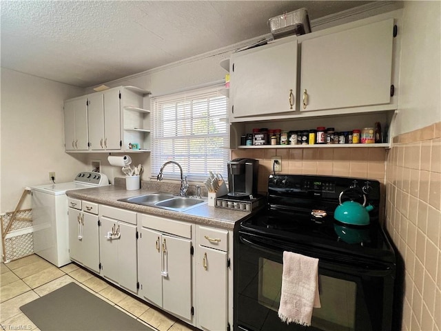 kitchen featuring light tile patterned floors, open shelves, a sink, washer / dryer, and black / electric stove