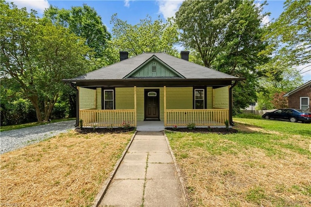 308 Worrell St, Thomasville, NC 27360 - bungalow-style house featuring a chimney, a porch, and a front yard