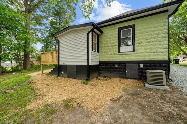 308 Worrell St, Thomasville, NC 27360 - view of side of property with a central air condition unit and a wooden deck