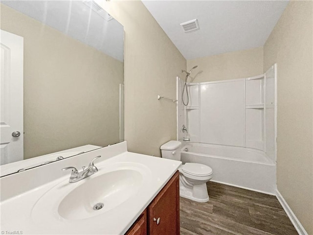 full bathroom featuring vanity, wood-type flooring, toilet, and shower / bath combination