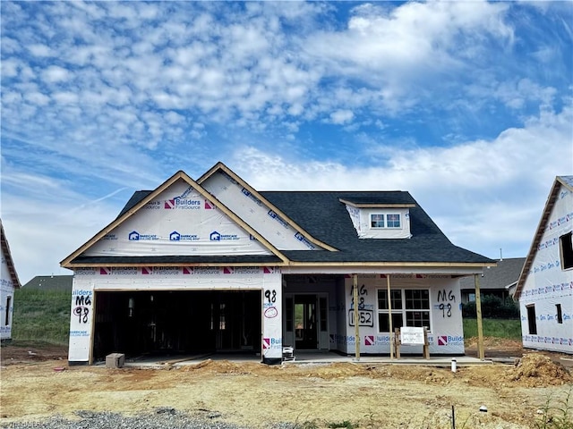 unfinished property with a porch and a garage