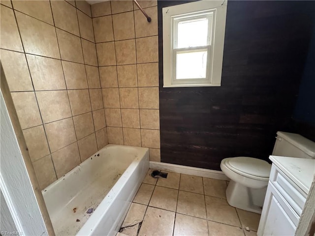 bathroom with tile patterned flooring, baseboards, toilet, and vanity