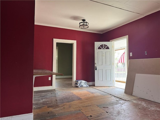foyer with crown molding and hardwood / wood-style floors