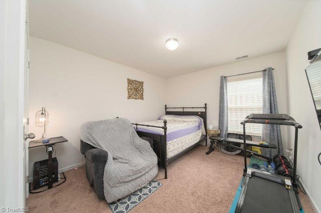 bedroom with carpet and baseboards