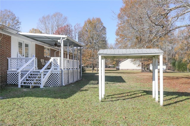 view of yard with a carport