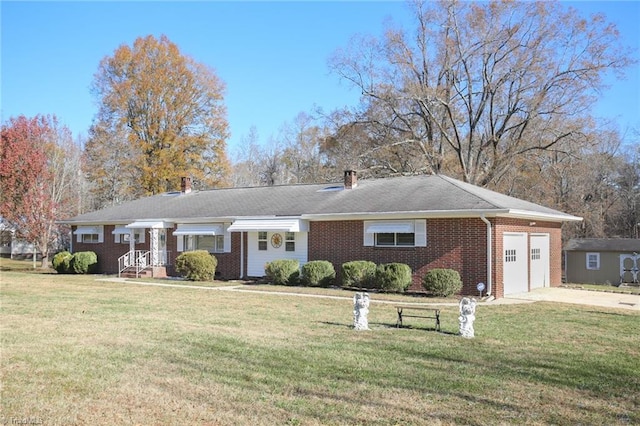 single story home with a garage and a front lawn