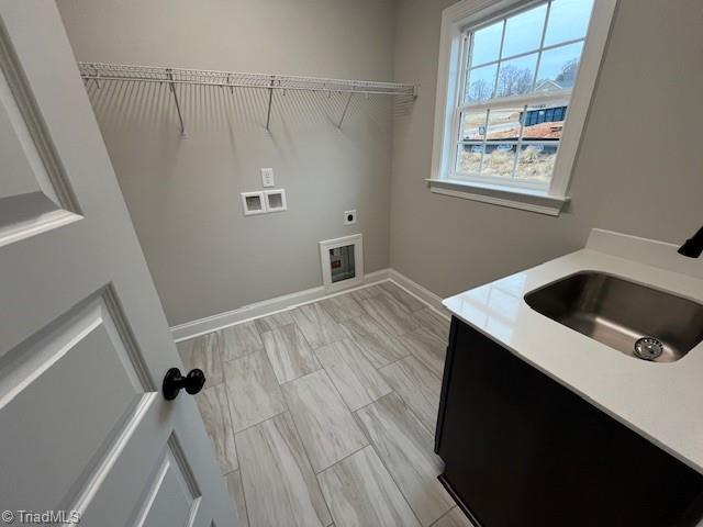 laundry area with washer hookup, sink, and electric dryer hookup