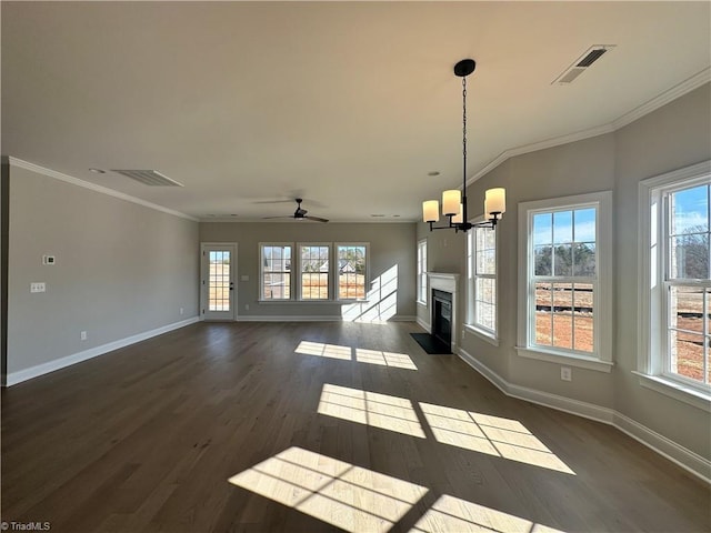 unfurnished living room with visible vents, baseboards, and plenty of natural light