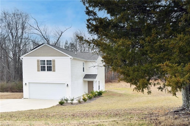 view of side of home with a garage and a yard