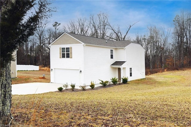 view of property exterior featuring a garage and a lawn