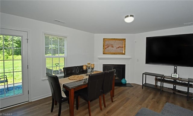 dining area featuring dark hardwood / wood-style flooring