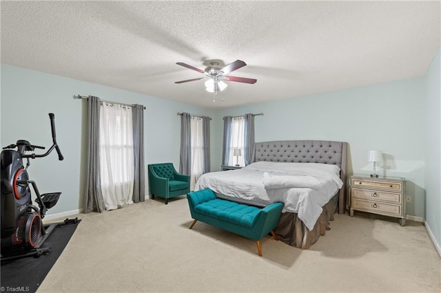 bedroom with light carpet, multiple windows, and ceiling fan