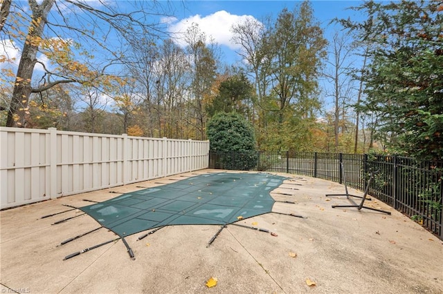 view of swimming pool featuring a patio