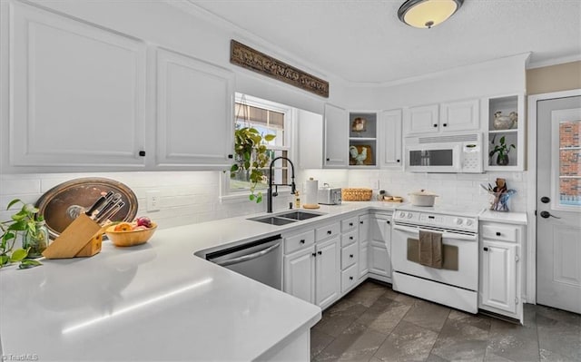 kitchen with white appliances, open shelves, ornamental molding, a sink, and light countertops