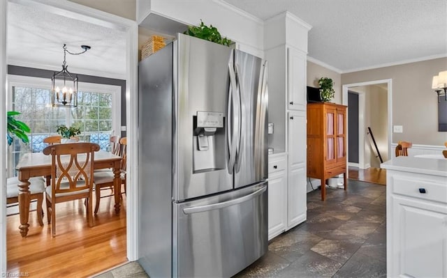 kitchen featuring crown molding, a chandelier, stainless steel refrigerator with ice dispenser, a textured ceiling, and white cabinetry