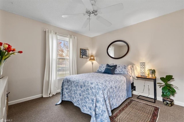 bedroom with ceiling fan, a textured ceiling, baseboards, and carpet