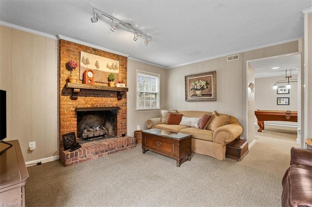 carpeted living room featuring billiards, a fireplace, visible vents, and ornamental molding