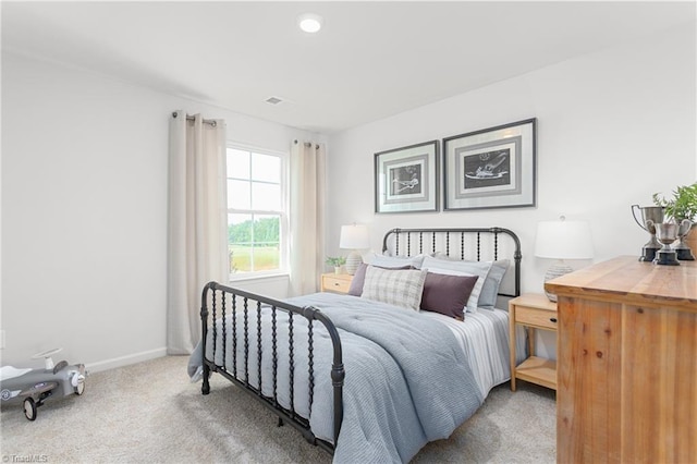 bedroom with light colored carpet