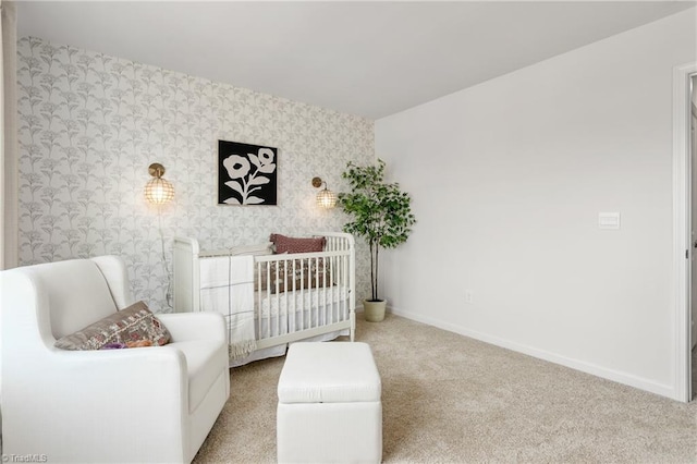 bedroom featuring carpet flooring and a crib