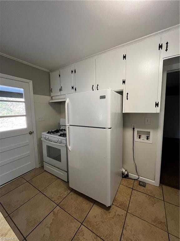 kitchen featuring crown molding, light tile patterned floors, white cabinets, and white appliances