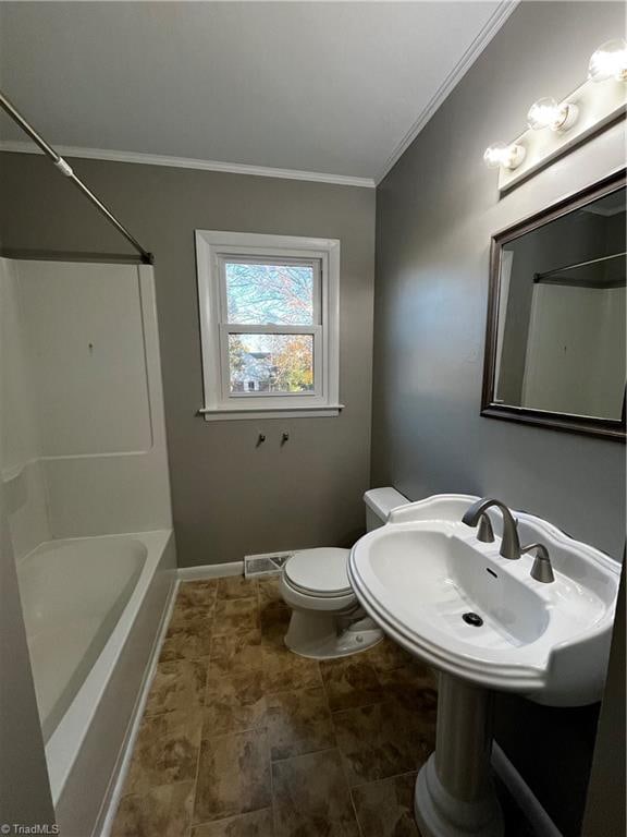 full bathroom featuring sink, toilet, shower / bathing tub combination, and ornamental molding