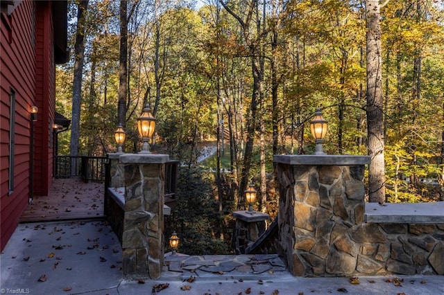 exterior space featuring a wooded view