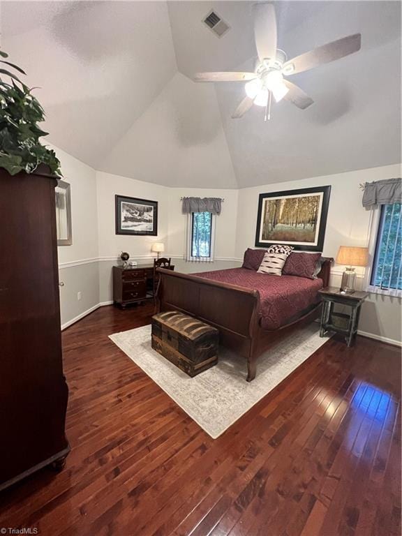 bedroom featuring wood-type flooring, visible vents, and multiple windows