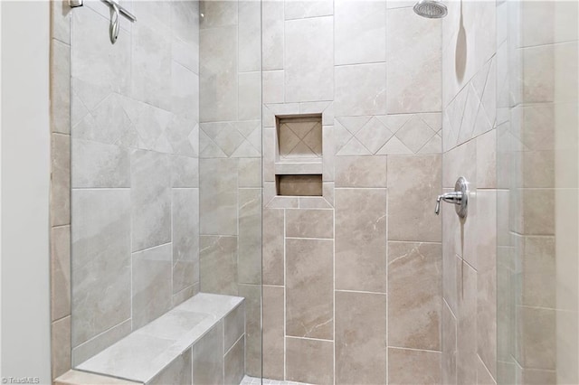 bathroom featuring tiled shower