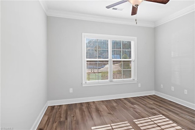 spare room featuring hardwood / wood-style flooring, ornamental molding, and ceiling fan