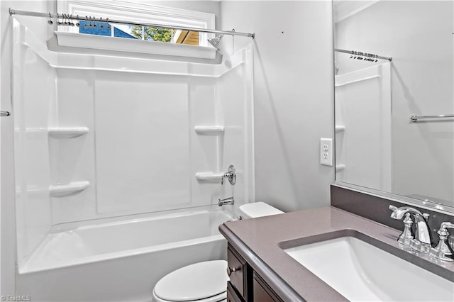 full bathroom featuring toilet, vanity, and shower / bathtub combination